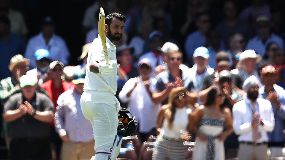Cheteshwar Pujara received a standing ovation. (Photo by Ryan Pierse/Getty Images)