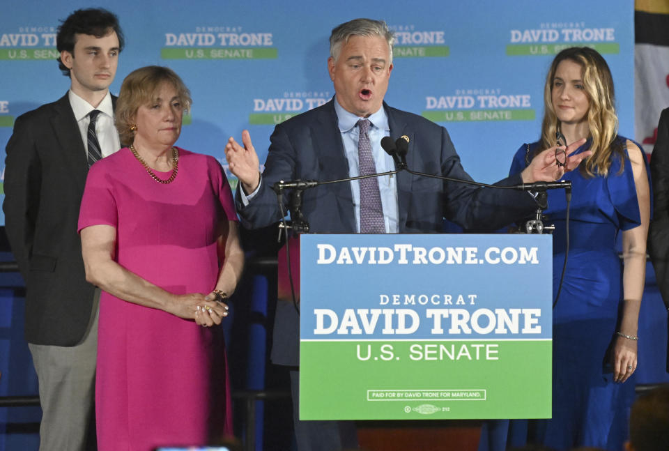 Rep. David Trone, third from left, a Democrat running for U.S. Senate, speaks to supporters, conceding the primary race to his opponent, Angela Alsobrooks, Tuesday, May 14, 2024, in Baltimore. Standing with Trone are his son Rob, left, wife, June, second from left, and daughter Michelle. (AP Photo/Steve Ruark)