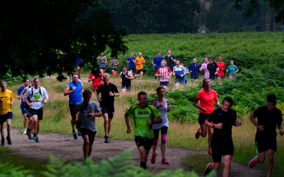 Runners taking part in the Parkrun at Bushy Park in London, the largest and oldest Parkrun in the UK, and one of many runs taking place across the country for the first time since last March. - Victoria Jones/PA Wire