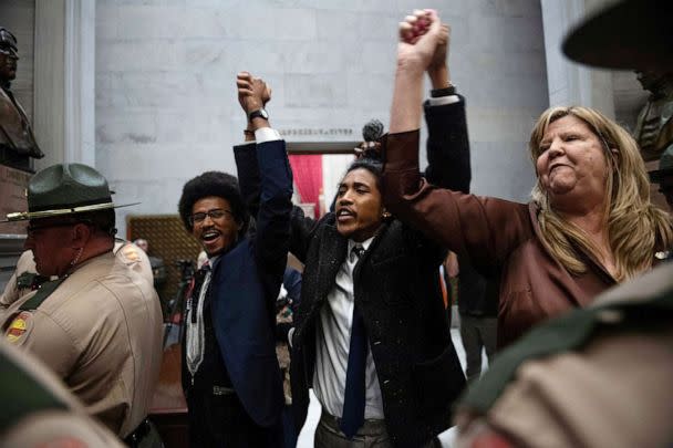 PHOTO: Tennessee Reps. Justin Pearson, Justin Jones and Gloria Johnson hold hands as they exit the House Chamber at the Tennessee State Capitol building, April 3, 2023, in Nashville. (Nicole Hester/USA Today Network via Reuters)