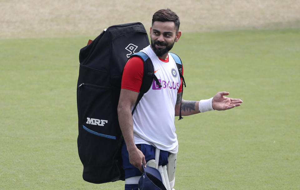 India's captain Virat Kohli gestures to a teammate after batting in the nets during a training session ahead of their first cricket test match against Bangladesh in Indore, India, Wednesday, Nov. 13, 2019. (AP Photo/Aijaz Rahi)