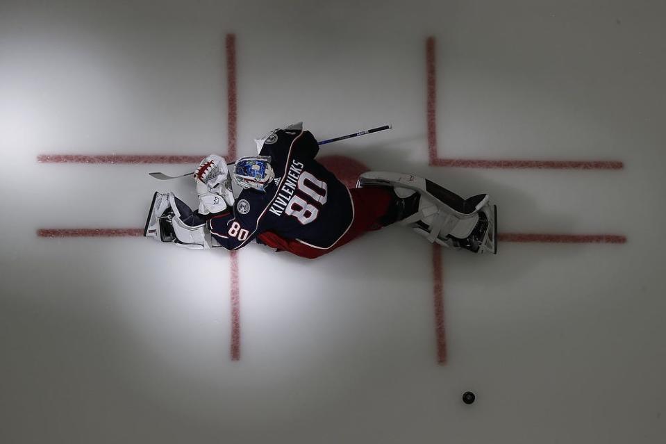 Columbus Blue Jackets goaltender Elvis Merzlikins wears Matiss Kivlenieks jersey for warm-ups prior to the season opening NHL hockey game against the Arizona Coyotes at Nationwide Arena in Columbus on Thursday, Oct. 14, 2021. 