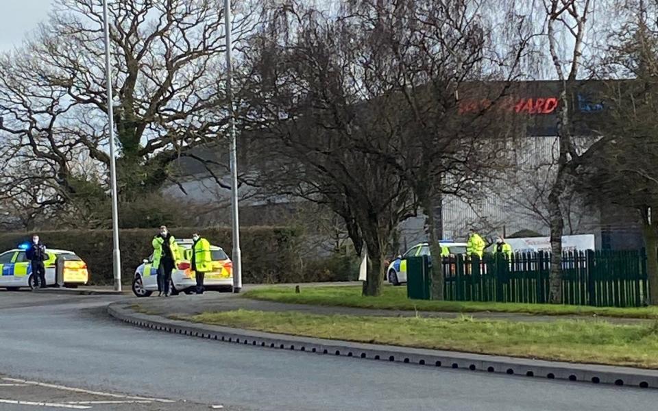 Police outside the factory - Ian Hunter