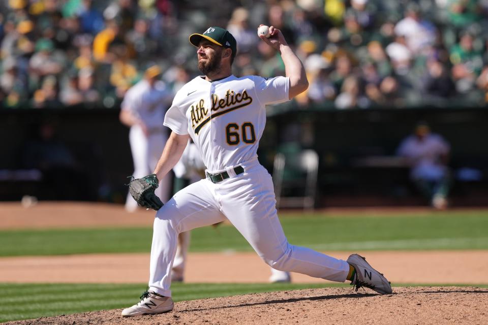 Apr 16, 2023; Oakland, California, USA; Oakland Athletics relief pitcher Sam Moll (60) throws a pitch against the New York Mets during the tenth inning at RingCentral Coliseum.