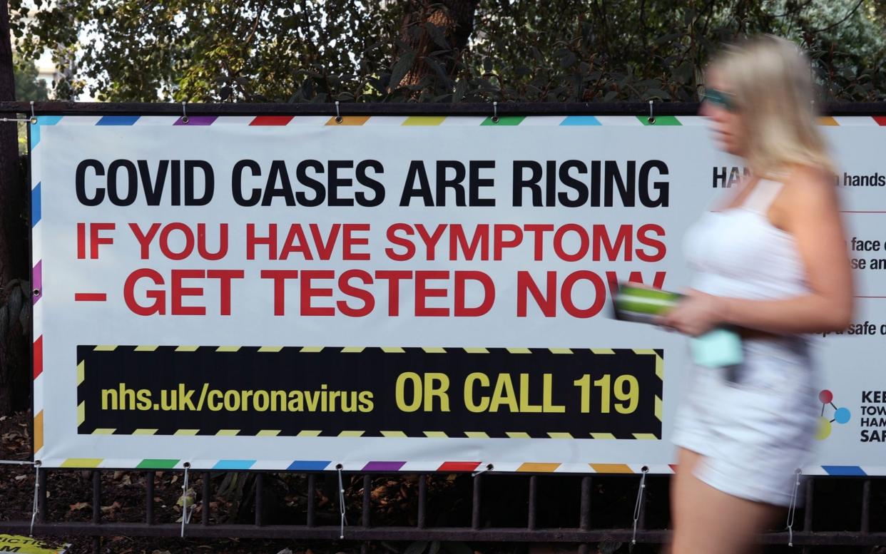 A coronavirus warning sign in London, where a draft three-tier scheme was set out by authorities this month - Yui Mok/PA