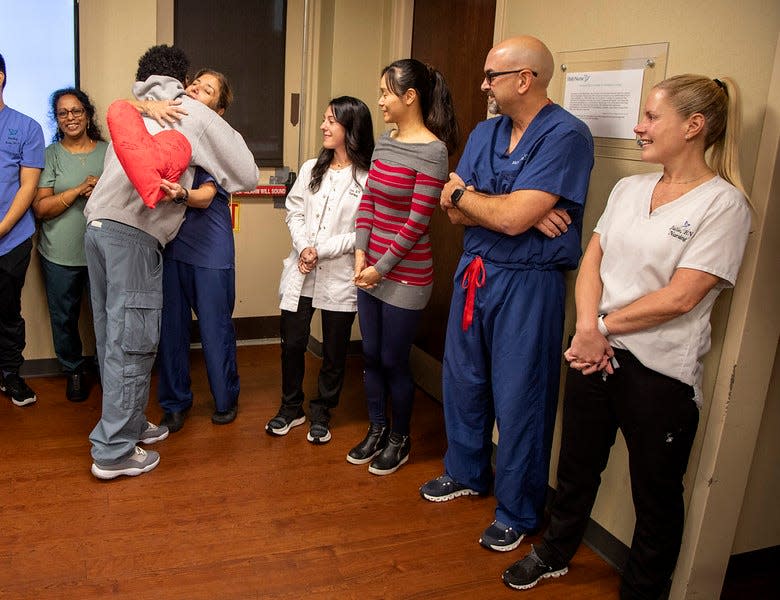 Kyle Hewitt greeting the Holy Name Medical Center team that saved his life months after his cardiac arrest.