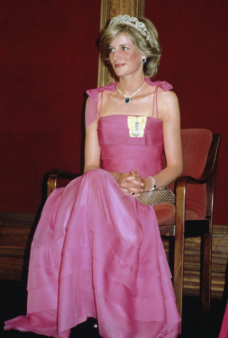 While at a state reception in Australia, Princess Diana stole the headlines in a fuchsia gown by Victor Edelstein. The mother-of-two's famous Spencer tiara, which she wore on her wedding day in 1991, gave the ensemble a regal touch. <em>[Photo: Getty]</em>