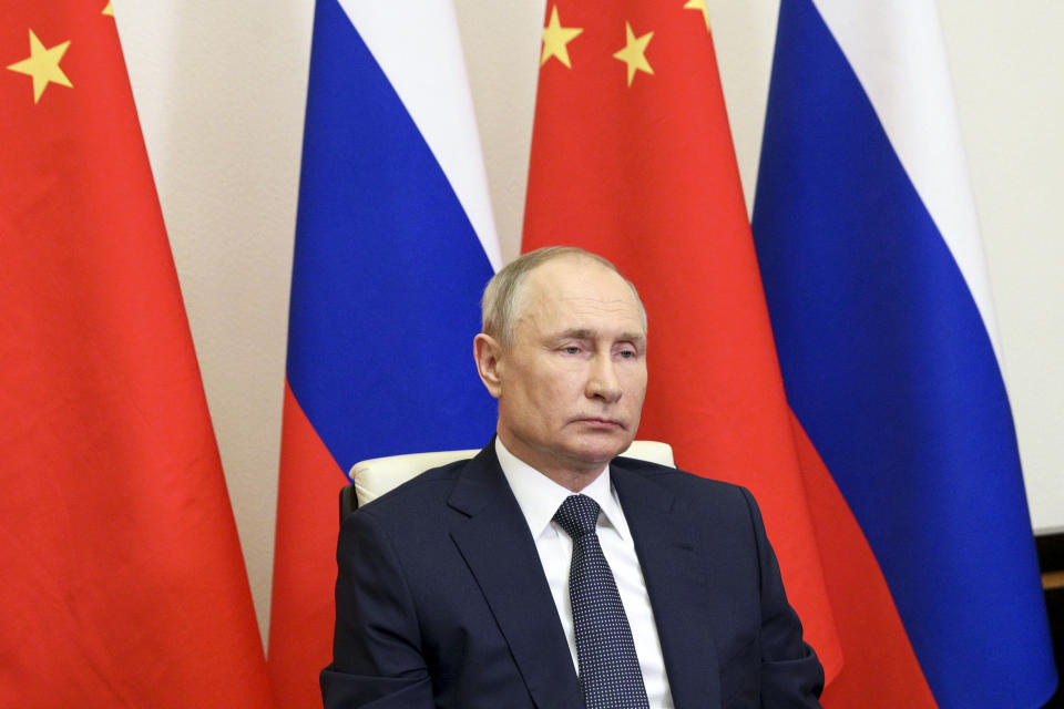 Russian President Vladimir Putin takes part in a virtual unveiling of a nuclear power plant in China together with Chinese President Xi Jinping via video conference at the Novo-Ogaryovo residence outside Moscow, Russia, Wednesday, May 19, 2021. (Sergei Ilyin, Sputnik, Kremlin Pool Photo via AP)