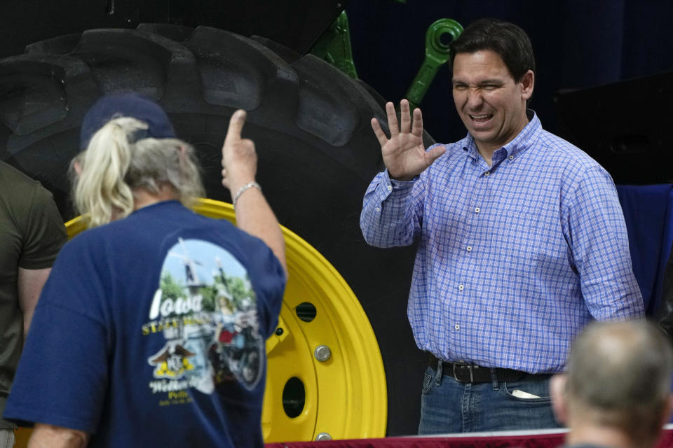 Republican presidential candidate and Florida Gov. Ron DeSantis greets an audience member before speaking at U.S. Sen. Joni Ernst's Roast and Ride, Saturday, June 3, 2023, in Des Moines, Iowa. (AP Photo/Charlie Neibergall)
