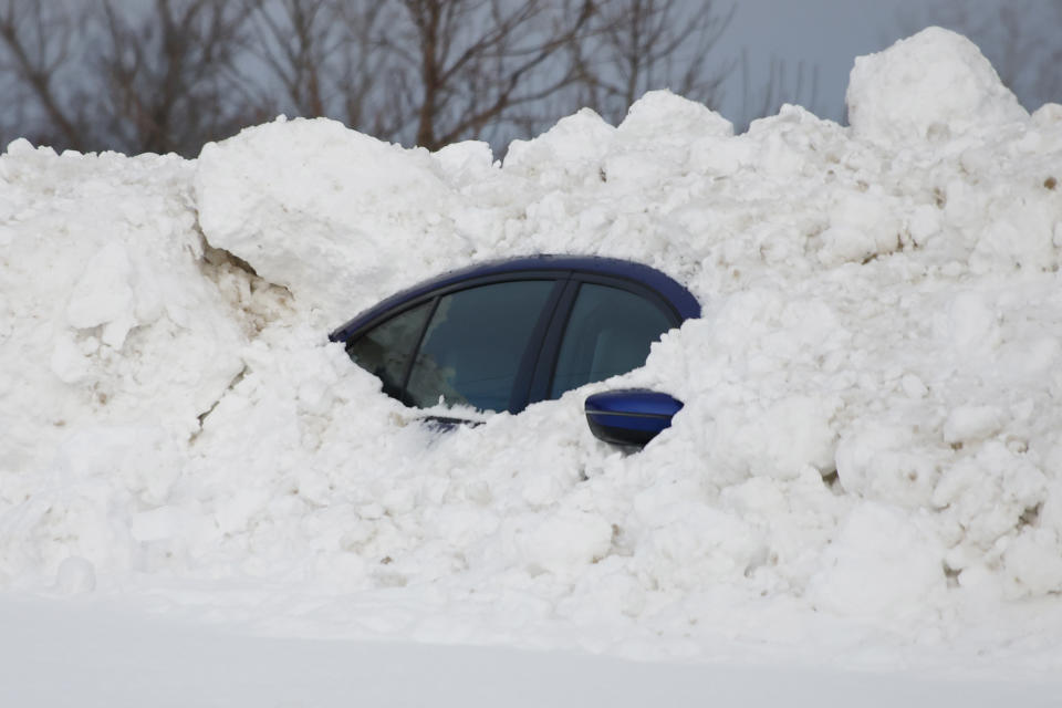 A car sits burried after a winter storm rolled through Western New York Wednesday, Dec. 28, 2022, in Buffalo N.Y. (AP Photo/Jeffrey T. Barnes)