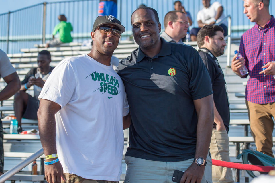 Malik Rose, right, poses with a fan in 2015. (Getty)