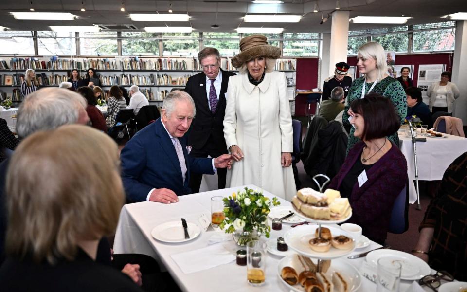 King Charles and the Queen Consort attend afternoon tea with volunteers and service users of Age UK in Colchester - POOL/via REUTERS