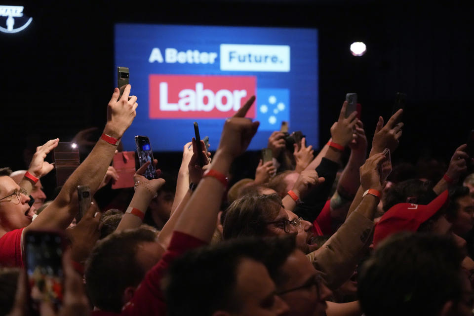 Supporter cheer the arrival of Labor Party leader Anthony Albanese at a Labor Party event in Sydney, Australia, Sunday, May 22, 2022, after Prime Minister Scott Morrison conceding defeat to Albanese in a federal election. (AP Photo/Rick Rycroft)