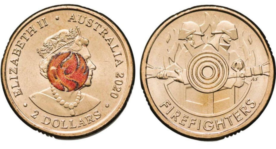 The front and back of the rare $2 firefighter coin.