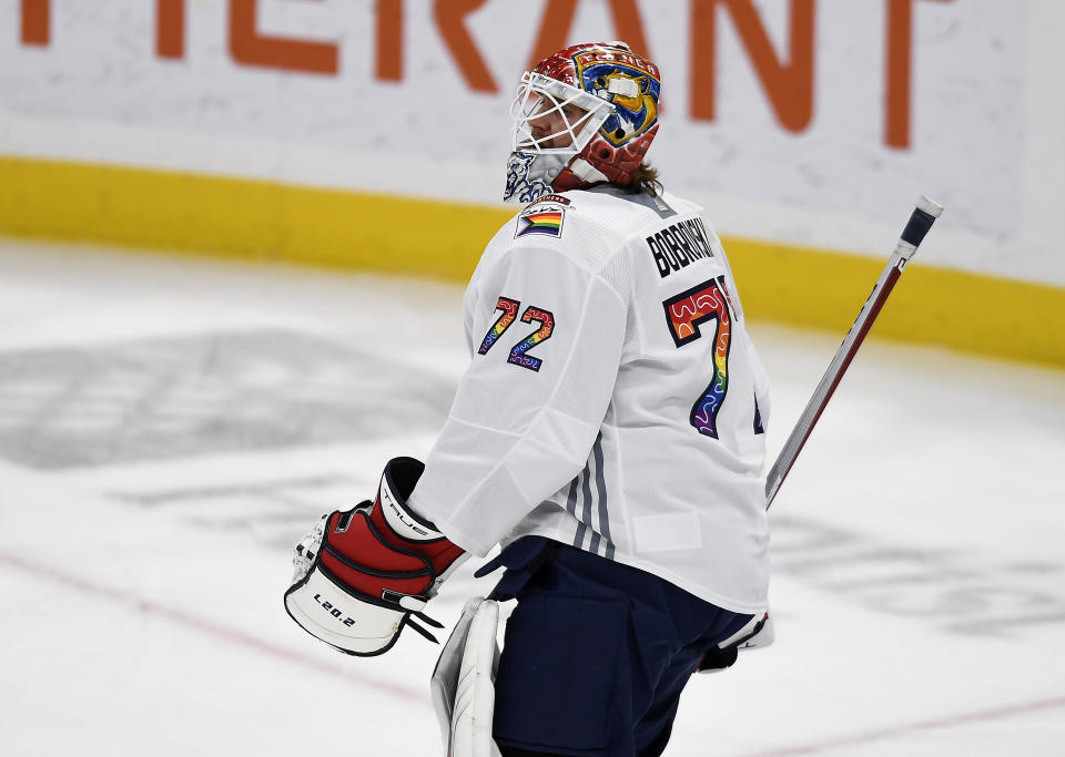 Florida Panthers goaltender Sergei Bobrovsky (72) warms up while wearing a Pride Night hockey jersey before playing the Toronto Maple Leafs, Thursday, March 23, 2023, in Sunrise, Fla. A handful of players have objected to participating in pregame warmups that included Pride-themed jerseys. (AP Photo/Michael Laughlin)