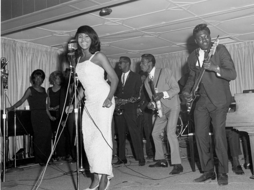 Husband-and-wife R&B duo Ike & Tina Turner perform onstage with a Fender Stratocaster electric guitar in 1964 in Dallas Fort Worth, Texas.