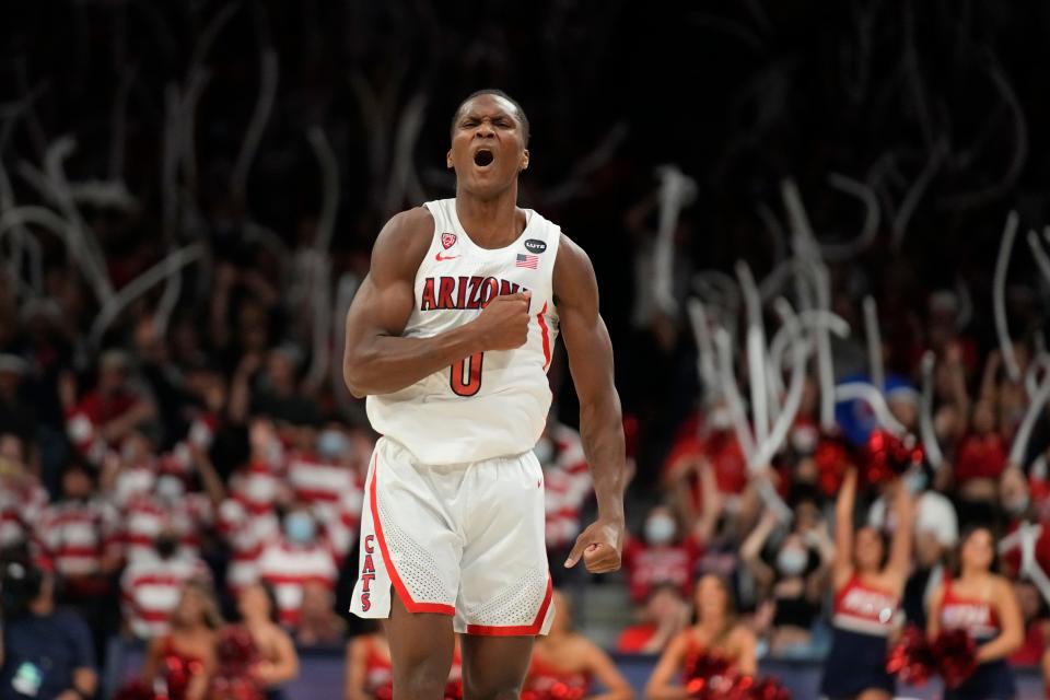 FILE - Arizona guard Bennedict Mathurin celebrates after scoring against Stanford during the second half of an NCAA college basketball game Thursday, March 3, 2022, in Tucson, Ariz. Mathurin is The Associated Press Pac-12 player of the year, announced, Tuesday, March 8, 2022.  (AP Photo/Rick Scuteri, File)