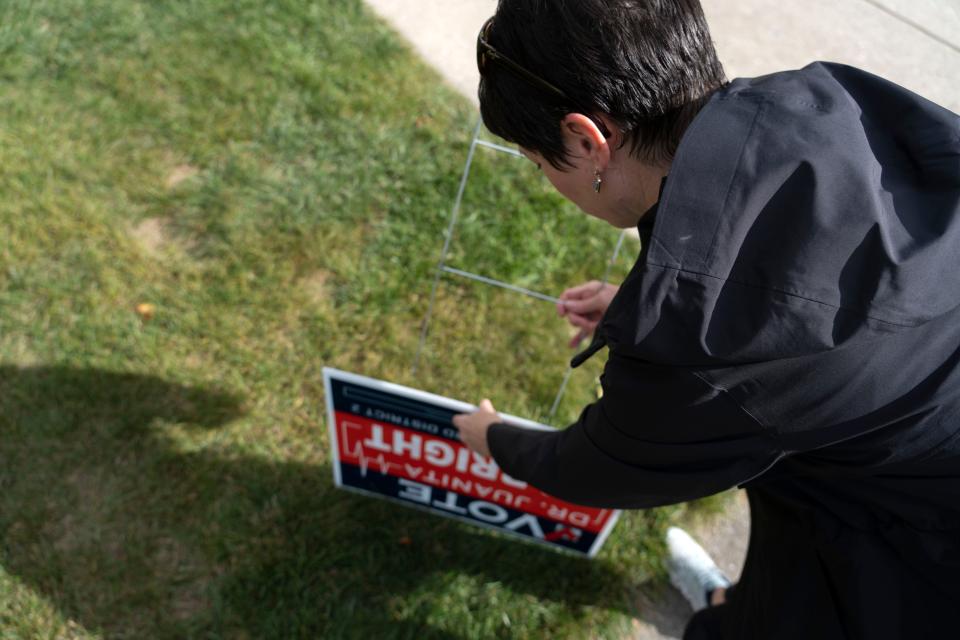 Dr. Juanita Albright, a school board candidate running for Hamilton Southeastern Schools' District 2 seat, plants a campaign sign on a supporter’s lawn Wednesday, Sept. 28, 2022, in Fishers. 