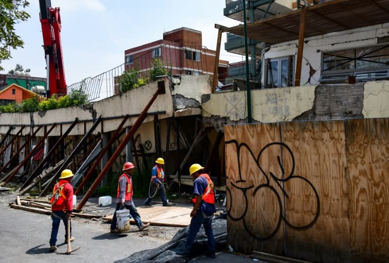 Workers preprare to demolish Enrique Rebsamen elementary school in Mexico city, on August 20, 2018. The school collapsed during the earthquake on september 19 2018, killing 19 children and seven adults