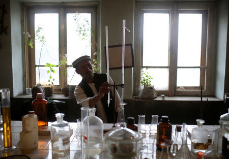 A man works in a laboratory at the Jabal Saraj cement factory in Jabal Saraj, north of Kabul, Afghanistan April 19, 2016. REUTERS/Ahmad Masood