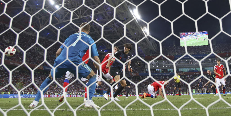 <p>Croatia’s Domagoj Vida, second right, heads the ball to score his side’s second goal during the quarterfinal match between Russia and Croatia at the 2018 soccer World Cup in the Fisht Stadium, in Sochi, Russia, Saturday, July 7, 2018. (AP Photo/Manu Fernandez) </p>