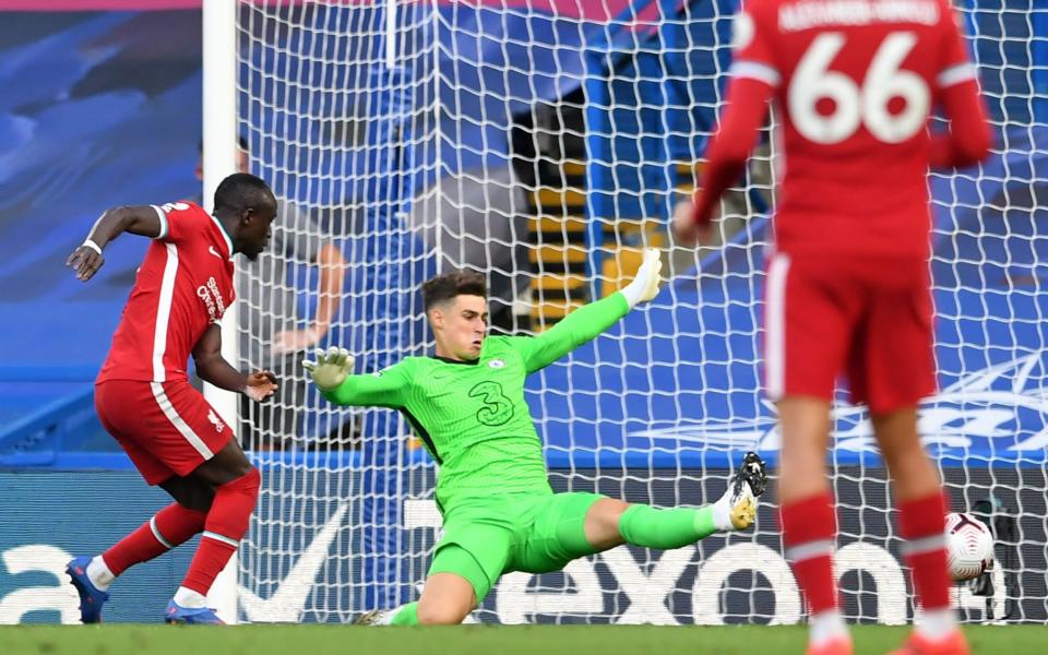 Liverpool's Senegalese striker Sadio Mane (L) scores their second goal past Chelsea's Spanish goalkeeper Kepa Arrizabalaga during the English Premier League football match between Chelsea and Liverpool at Stamford Bridge in London on September 20, 2020. - AFP