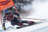 United States' Mikaela Shiffrin speeds down the course during an alpine ski, women's World Cup downhill race, in Cortina d'Ampezzo, Italy, Friday, Jan. 20, 2023. (AP Photo/Gabriele Facciotti)