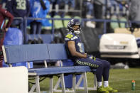 Seattle Seahawks' Tyler Lockett sits on the bench after his team lost to the New Orleans Saints in an NFL football game, Monday, Oct. 25, 2021, in Seattle. (AP Photo/Ted S. Warren)