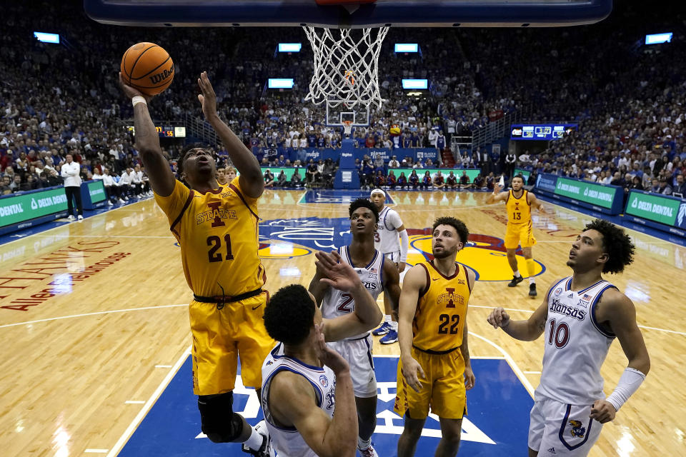 Iowa State center Osun Osunniyi (21) puts up a shot during the second half of an NCAA college basketball game against Kansas Saturday, Jan. 14, 2023, in Lawrence, Kan. Kansas won 62-60 (AP Photo/Charlie Riedel)