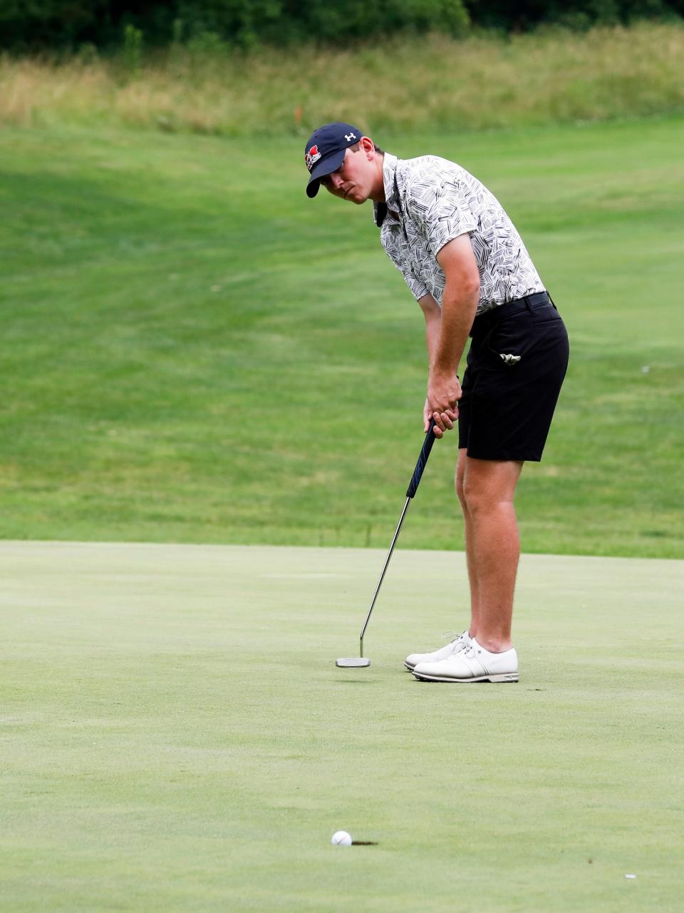 Blake Hartford sinks a birdie putt on the par-5 15tth hole during the final round of the 46th annual Zanesville District Golf Association Amateur tournament on Sunday at Zanesville Country Club. Hartford shot 5-under-67 to win for the second straight year.