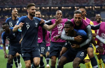 Soccer Football - World Cup - Final - France v Croatia - Luzhniki Stadium, Moscow, Russia - July 15, 2018 France's Paul Pogba celebrates scoring their third goal with Corentin Tolisso and team mates REUTERS/Carl Recine