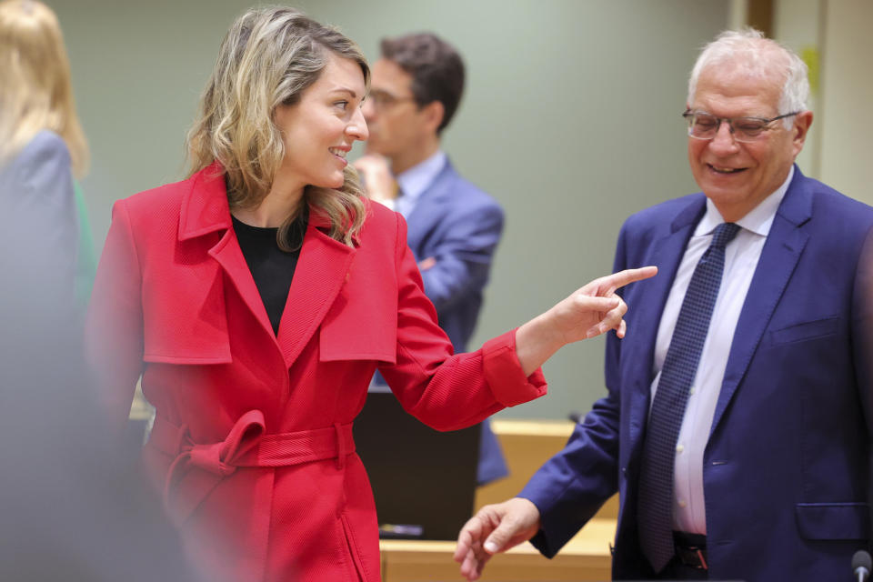 Canadian minister of foreign affairs Mélanie Joly and European Union foreign policy chief Josep Borrell arrive for a meeting of EU foreign ministers at the European Council building in Brussels, Monday, May 16, 2022. European Union foreign ministers on Monday will discuss current affairs and have an exchange of views on the Russian aggression against Ukraine and the Global Gateway. (AP Photo/Olivier Matthys)