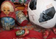 A replica of the FIFA World Cup ball and Matryoshka souvenirs are seen in a shop window in central Moscow, Russia, July 3, 2018. REUTERS/John Sibley