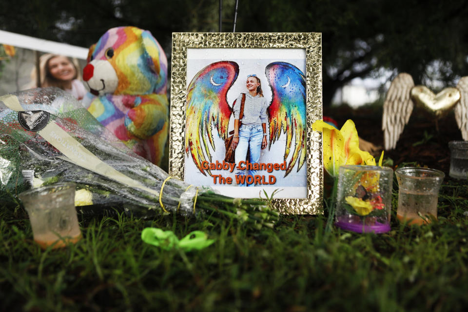 Flowers and photographs adorn a makeshift memorial dedicated for Gabby Petito in North Port, Fla., on Sept. 21, 2021. (Octavio Jones / Getty Images)