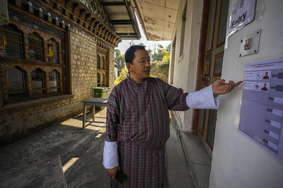 An election official shows a ballot paper displayed outside a polling station on the eve of general election in Deothang in Bhutan, Monday, Jan. 8, 2024. (AP Photo/Anupam Nath)