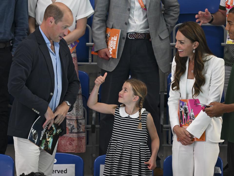 Princess Charlotte gives a thumbs-up to Prince William and Kate Middleton at the Commonwealth Games