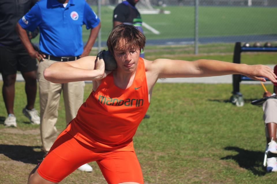 Alex Potts of Mandarin prepares to launch in the boys shot put during the Gateway Conference high school track and field meet at the University of North Florida's Hodges Stadium on April 5, 2024. [Clayton Freeman/Florida Times-Union]