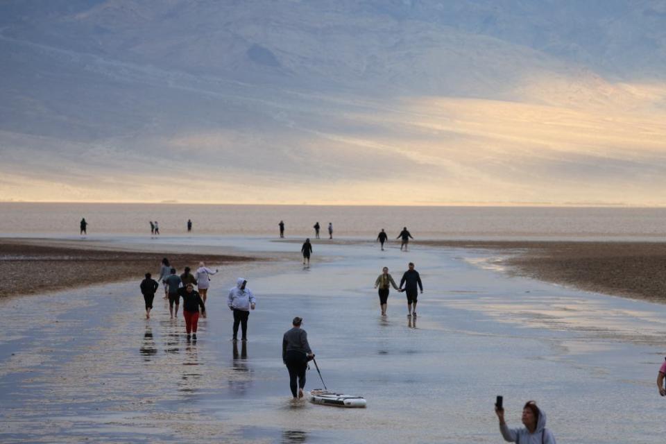 Visitors are swimming, paddleboarding, kayaking and just soaking up the sun in lawn chairs. AFP via Getty Images