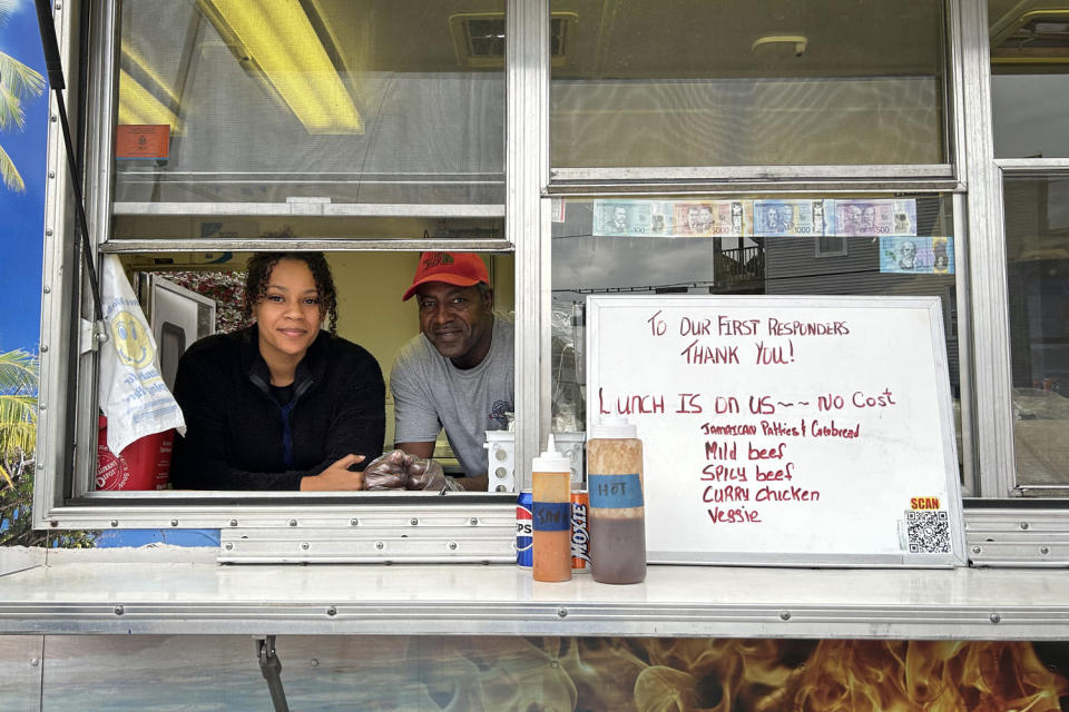 Chef Jeff Bailey and his daughter Gabriel have been offering free food to first responders from their Jamaican food truck. (Alex Seitz-Wald / NBC News)