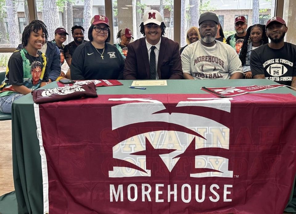 Rooster Bing of Savannah Country Day, pictured with his family, as he signed to play football at Morehouse College on April 10, 2024.