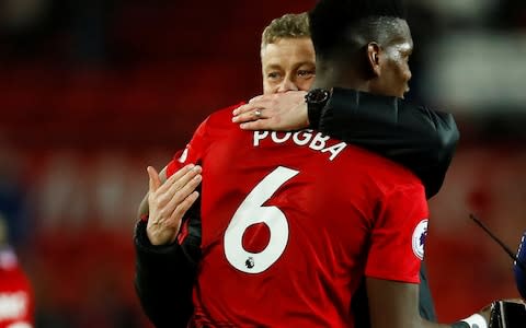 Manchester United interim manager Ole Gunnar Solskjaer celebrates with Paul Pogba - Credit: Reuters