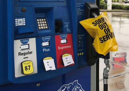 A gas pump is covered with an out of service message as fuel ran out ahead of Hurricane Harvey's arrival near the Texas coastal area, in Houston, Texas, U.S., August 25, 2017. REUTERS/Ernest Scheyder