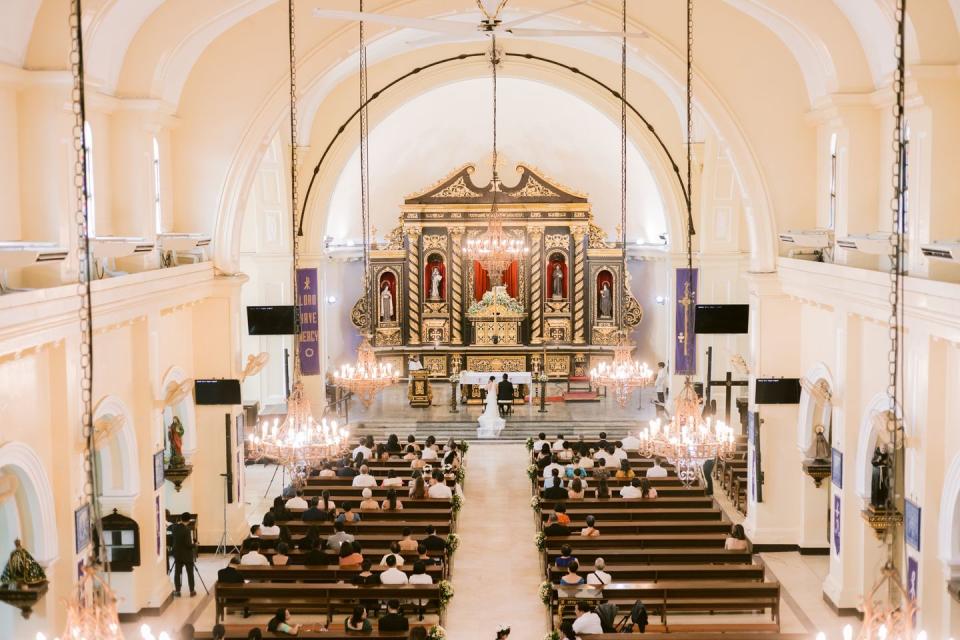 a large church with a large group of people sitting in the front