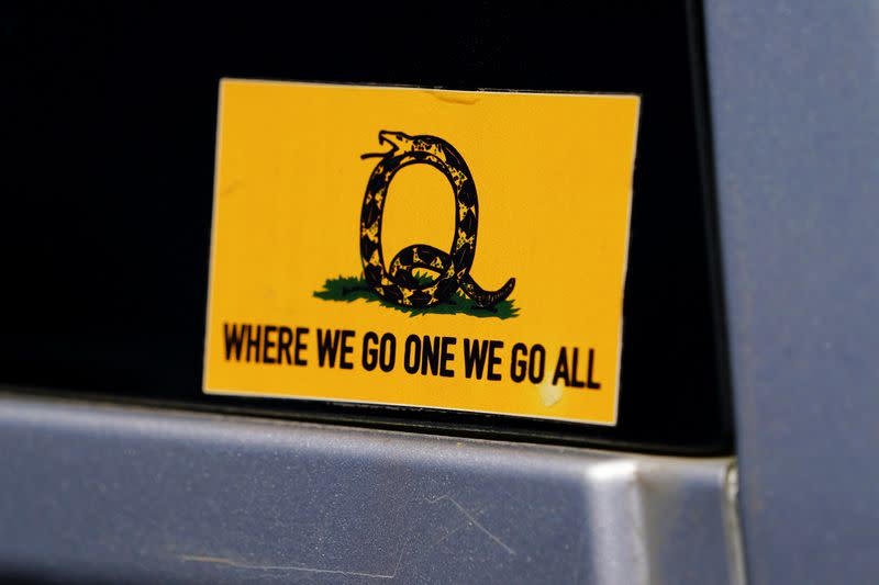 FILE PHOTO: A sticker that references the QAnon slogan is seen on a truck that participated in a caravan convoy in Adairsville