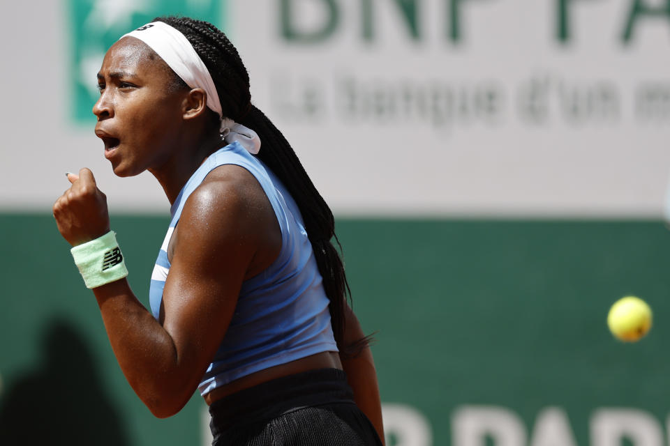 Coco Gauff of the U.S. celebrates winning her first round match of the French Open tennis tournament against Spain's Rebeka Masarova in three sets, 3-6, 6-1, 6-2, at the Roland Garros stadium in Paris, Tuesday, May 30, 2023. (AP Photo/Jean-Francois Badias)