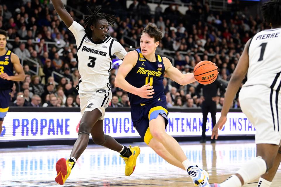 Marquette guard Tyler Kolek drives the ball against Providence guard Garwey Dual during the game on Dec. 19 at the Amica Mutual Pavilion. Kolek, a Cumberland native, has declared for the NBA Draft.