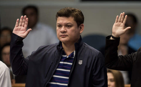This file photo taken on September 7, 2017 shows Davao City Vice Mayor Paolo Duterte, son of Philippine President Rodrigo Duterte, taking an oath as he attends a senate hearing in Manila - Credit: AFP