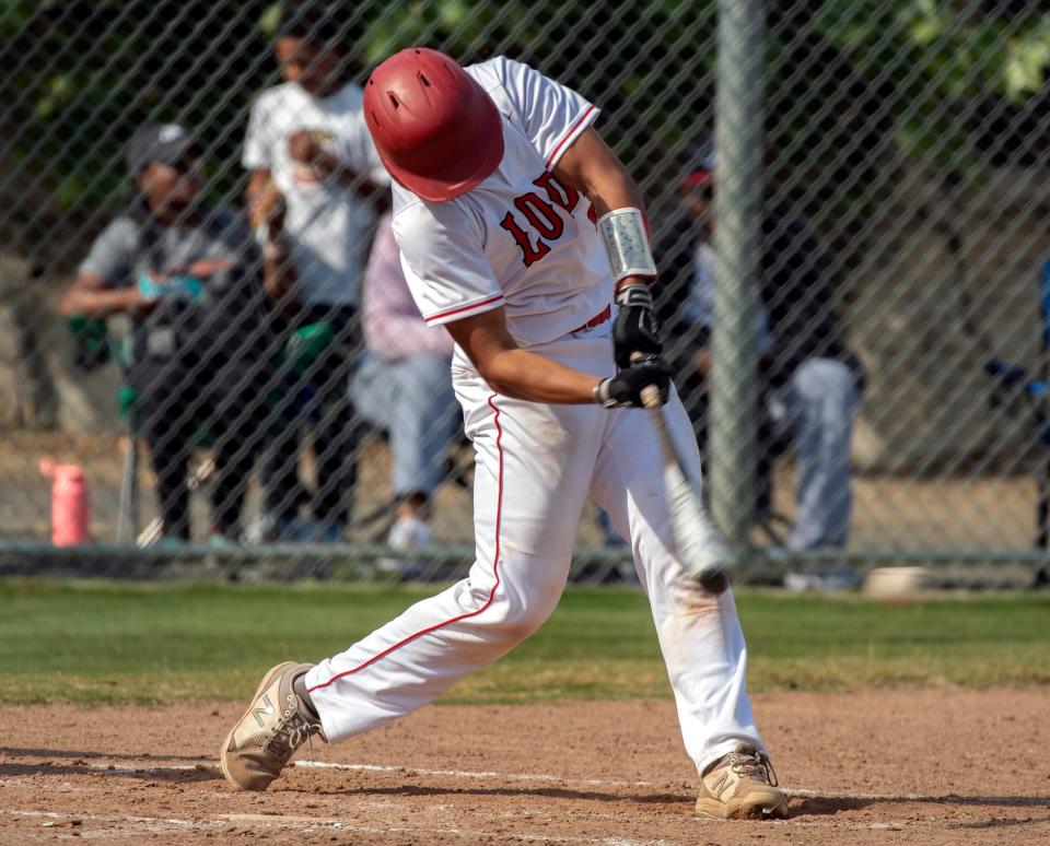 Lodi's Gavin Mora hits a double during a varsity baseball game against Mountain House at Tony Zupo Field in Lodi on Tuesday, May, 9, 2023. Lodi won 6-4.