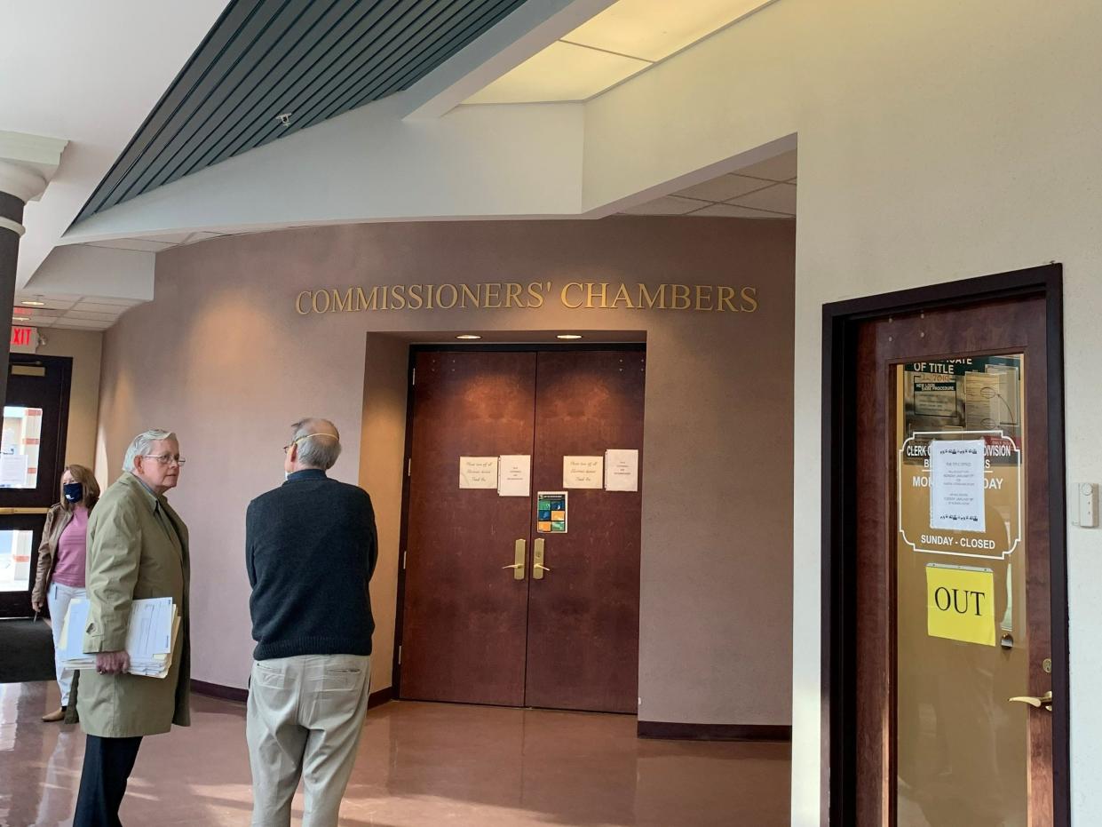 Representatives from Marion City and Marion County wait to enter the Jan. 13 Land Bank meeting in the County Commissioners' Chambers.