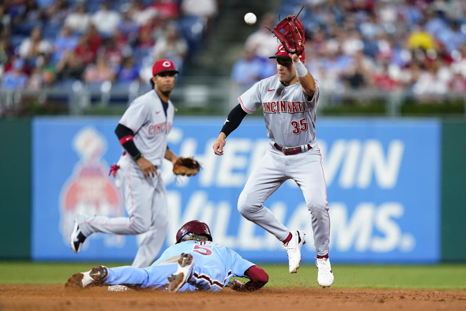 Philadelphia Phillies' Bryson Stott, left, steals second past Cincinnati Reds second baseman Alejo Lopez during the sixth inning of a baseball game, Thursday, Aug. 25, 2022, in Philadelphia. (AP Photo/Matt Slocum)